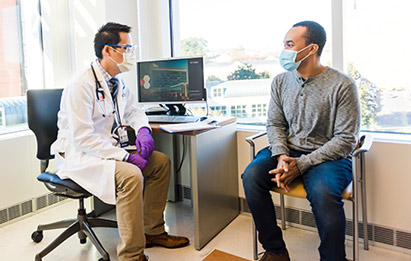 a patient referred to a clinical trial talks with a uva health specialist